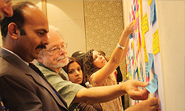 Participants clustering priority options during the plenary session